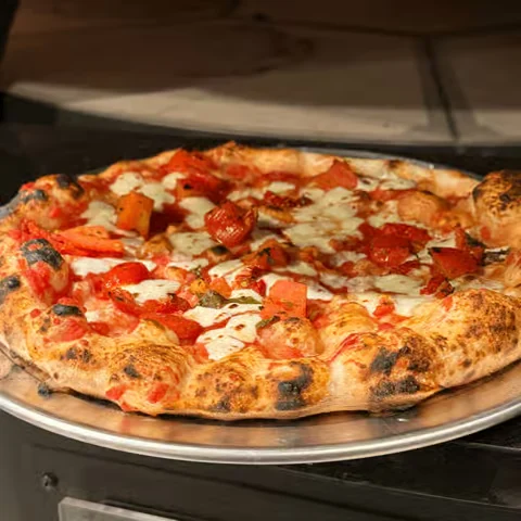 A Margherita pizza from World of Pizzas Bar & Grill