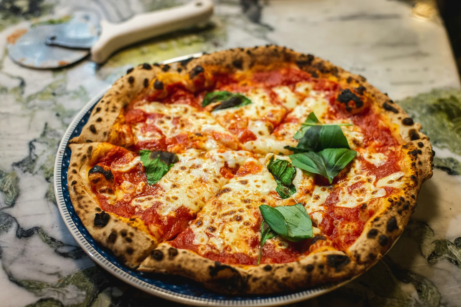 A Neapolitan-style Margherita pizza with fresh basil